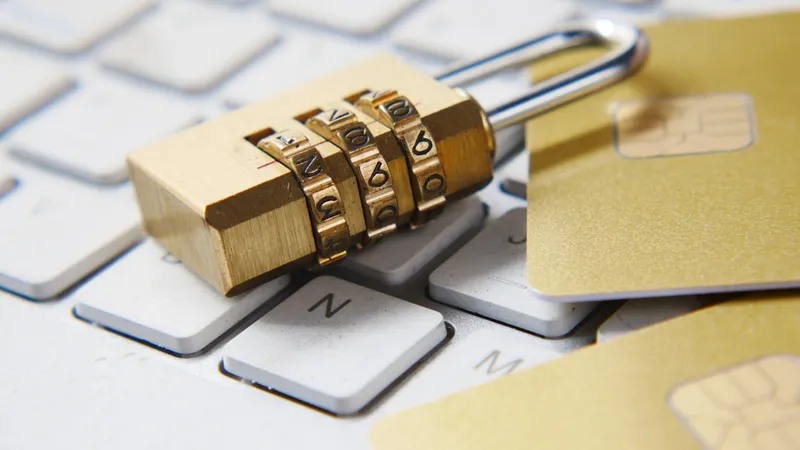 A golden padlock sitting on top of a black computer keyboard representing advanced digital and link security