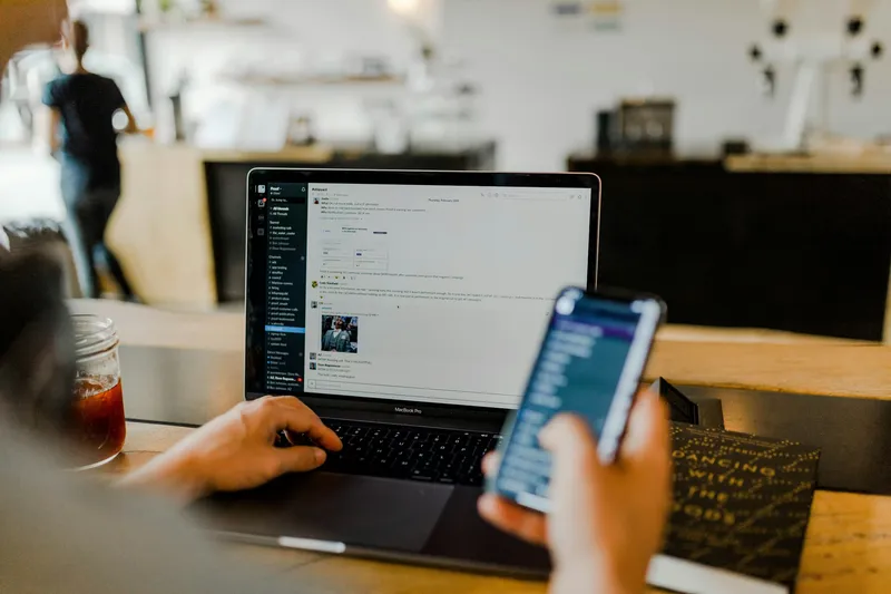 Person holding a smartphone displaying a link